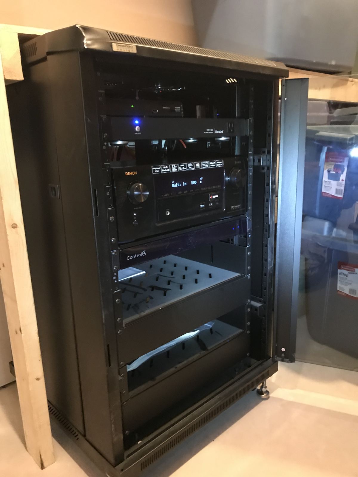 Equipment rack with AV receiver and automation controller