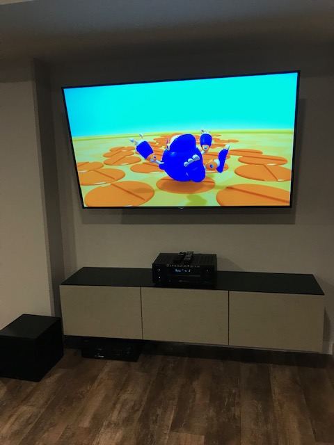 Wall-mounted TV in a family room
