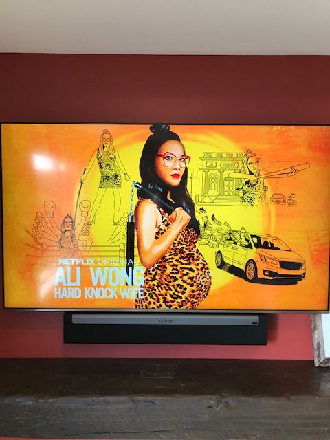 Wall-mounted TV and soundbar in a living room